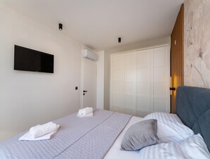 Appartement | 2 chambres, ameublement personnalisé, fer et planche à repasser