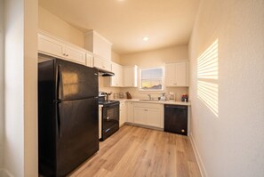 Coffee/tea maker, fridge, microwave, oven