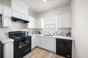 Fridge, microwave, oven, stovetop - Cozy Family Home with Game Room, Near Downtown (Galveston)