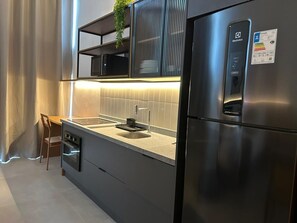 Deluxe Double Room | Private kitchen | Fridge, microwave, oven, stovetop