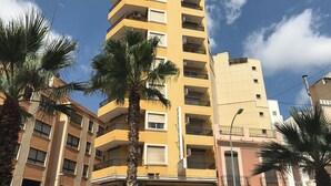 A multi-story yellow building with a restaurant named "Imperial" on the ground floor. - Hotel Cullera Coast by Mij (Cullera)
