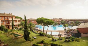 A resort with multiple swimming pools, lounge areas, and well-maintained gardens. - Ilunion Sancti Petri (Chiclana de la Frontera)