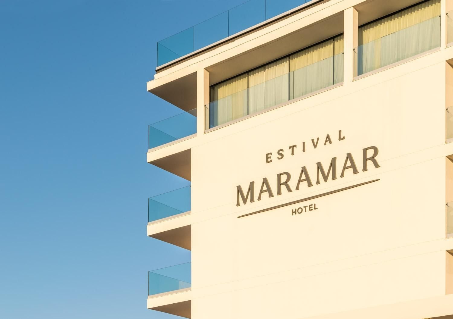 The exterior of the Estival Maramar Hotel with a clear sky background.