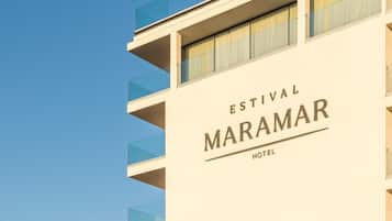 The exterior of the Estival Maramar Hotel with a clear sky background.