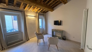 Rom – deluxe, 1 soverom | Oppholdsområde