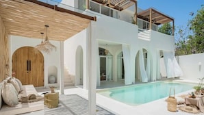 A modern house with a pool, white exterior, and wooden accents. - Mazari Villas (Bali)