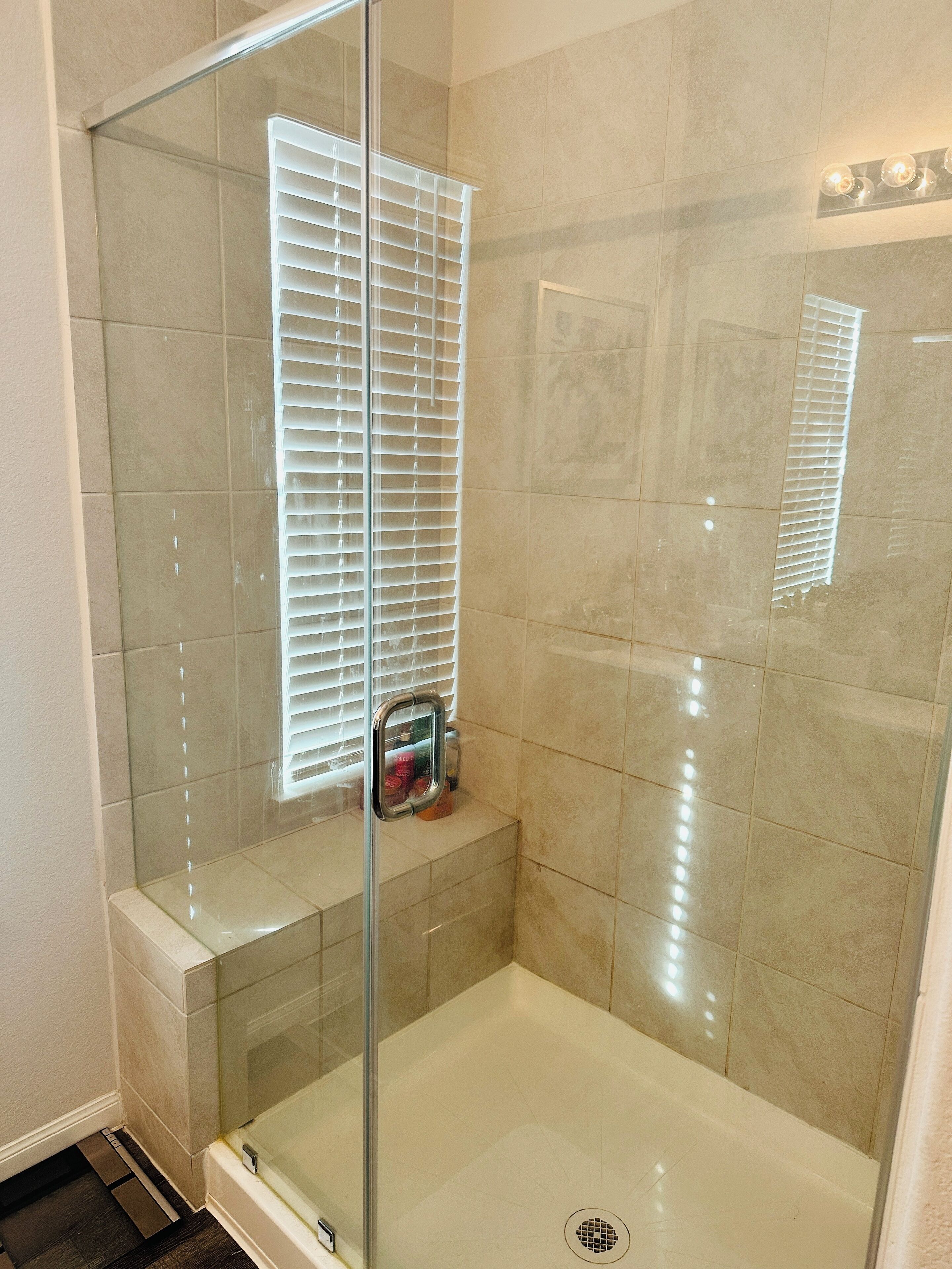 Shower, hair dryer, towels, toilet paper