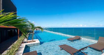 Beachfront Building With Pool and gym - Arus