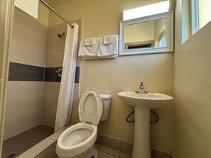 Shower, towels, soap, toilet paper