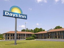 A Days Inn sign with a sun logo, indicating a hotel with a simple, functional design.