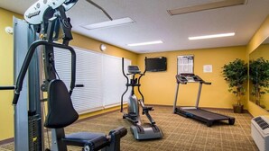 A fitness room with a weight machine, an elliptical, and a treadmill. - Red Roof Inn Jasper (Jasper)
