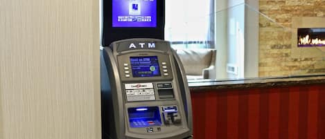 An ATM machine with a screen displaying 'ATM' and 'HYUNGSUNG' branding.