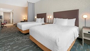 A hotel room with two beds, a desk, a chair, and a television. - Home2 Suites by Hilton Somerset (Somerset)