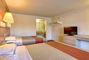 A hotel room with two beds, a television, a desk, and a mirror. - Motel6 Hagerstown, MD (Hagerstown)