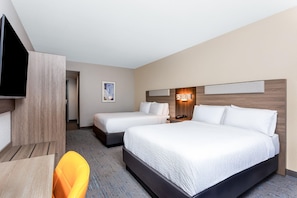 A hotel room with two beds, a TV, a desk, and a chair. - Holiday Inn Express & Suites Palm Coast - I-95 (Palm Coast)