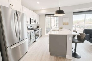 Fridge, microwave, oven, stovetop - Luxury 2BR Uptown Retreat | Steps from Bde Maka (Minneapolis)