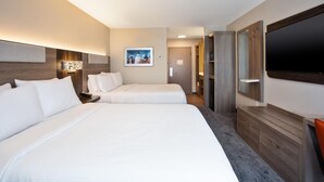 A hotel room with two beds, a TV, a desk, and a wardrobe. - Holiday Inn Express Kitty Hawk Outer Banks (Kitty Hawk)