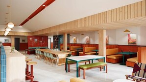 A modern restaurant interior with high tables, booths, and bar seating. - Loge St. George (St. George)