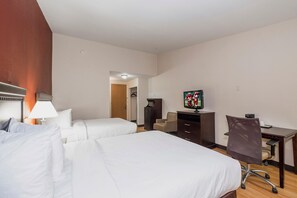 A hotel room with two beds, a desk, a chair, a TV, and a wardrobe. - Red Roof Inn & Suites Mt Holly - Mcguire AFB (Mount Holly)