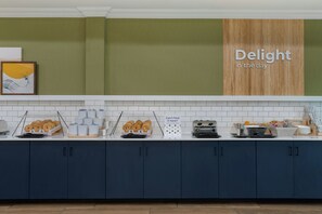 A breakfast buffet with various food items and a sign that reads 'Delight in the day'. - Spark by Hilton Rahway (Rahway)