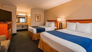 A hotel room with two beds, a TV, a bathroom, and a desk. - Best Western San Diego Pacific Beach/mission Bay (San Diego)