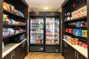 A snack and beverage vending area with various snacks, drinks, and condiments. - Best Western Inn & Suites San Diego - Zoo/seaworld Area (San Diego)