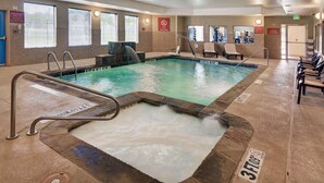 An indoor swimming pool with a hot tub, lounge chairs, and a no diving sign. - Motel6 Fort Worth, TX I-35 & I-20 (Fort Worth)