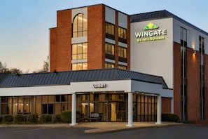 A modern building with a 'Lobby' entrance, a 'Wingate by Wyndham' sign, and a brick facade. - Wingate by Wyndham Williamsburg (Williamsburg)