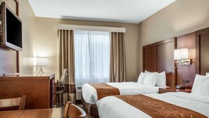 A hotel room with two beds, a desk, a TV, and a window with curtains. - Fairfield Inn & Suites by Marriott Scottsdale Old Town (Scottsdale)