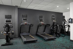 A fitness room with treadmills, ellipticals, and a stationary bike. - Towneplace Suites by Marriott Birmingham South (Birmingham)