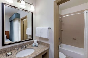 A bathroom with a large mirror, two sinks, a shower, and a toilet. - Comfort Suites Baton Rouge South I-10 (Baton Rouge)