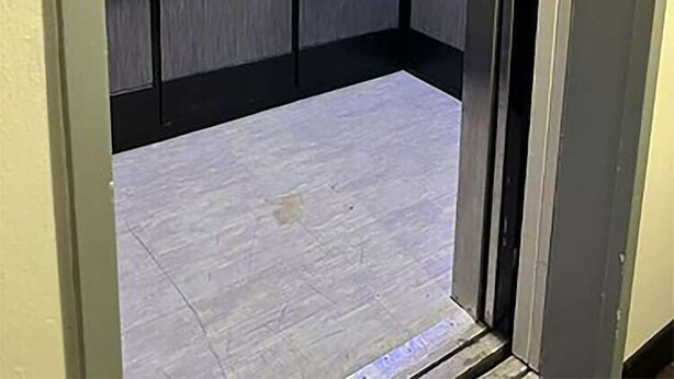 An elevator with a metallic interior, a handrail, and a door marked with the number 3. - Fairbridge Inn Express Indianapolis Northwest (Indianapolis)