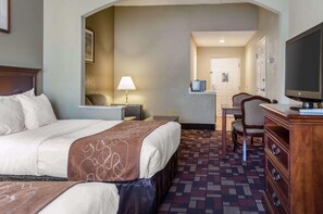 A hotel room with a bed, a desk, a chair, a television, and a door. - Best Western Grantville/hershey (Grantville)