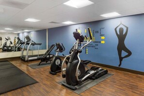 A gym with cardio machines, a mirrored wall, and motivational words on the wall. - Best Western Grantville/hershey (Grantville)