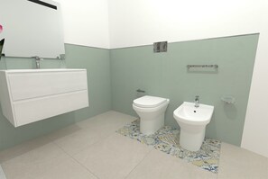 Une salle de bain équipée de toilettes, d’un bidet et d’un lavabo fixé au mur.