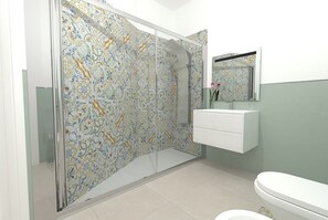 A bathroom with a shower enclosure, a sink, and a toilet. - Villa Calipso (Palermo)