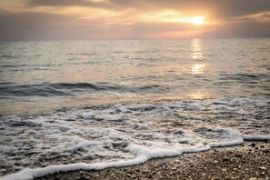 Playa privada, bote de remos