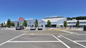 A hotel with a 'MyChef' restaurant, a bar, and a parking lot with marked lanes and trees. - Testani Colleferro (Colleferro)