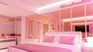 A modern bedroom with a large bed, a vanity, and a mirror. - Odsweet Duomo Milano Hotel (Milan)