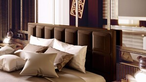 A bed with a headboard, pillows, and a bedside table with a lamp. - Odsweet Duomo Milano Hotel (Milan)