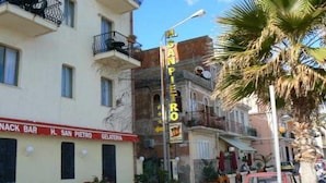A street view with a building labeled "H. San Pietro Gelateria" and a sign for "San Pietro". - Hotel San Pietro Beach - Letojanni (Letojanni)