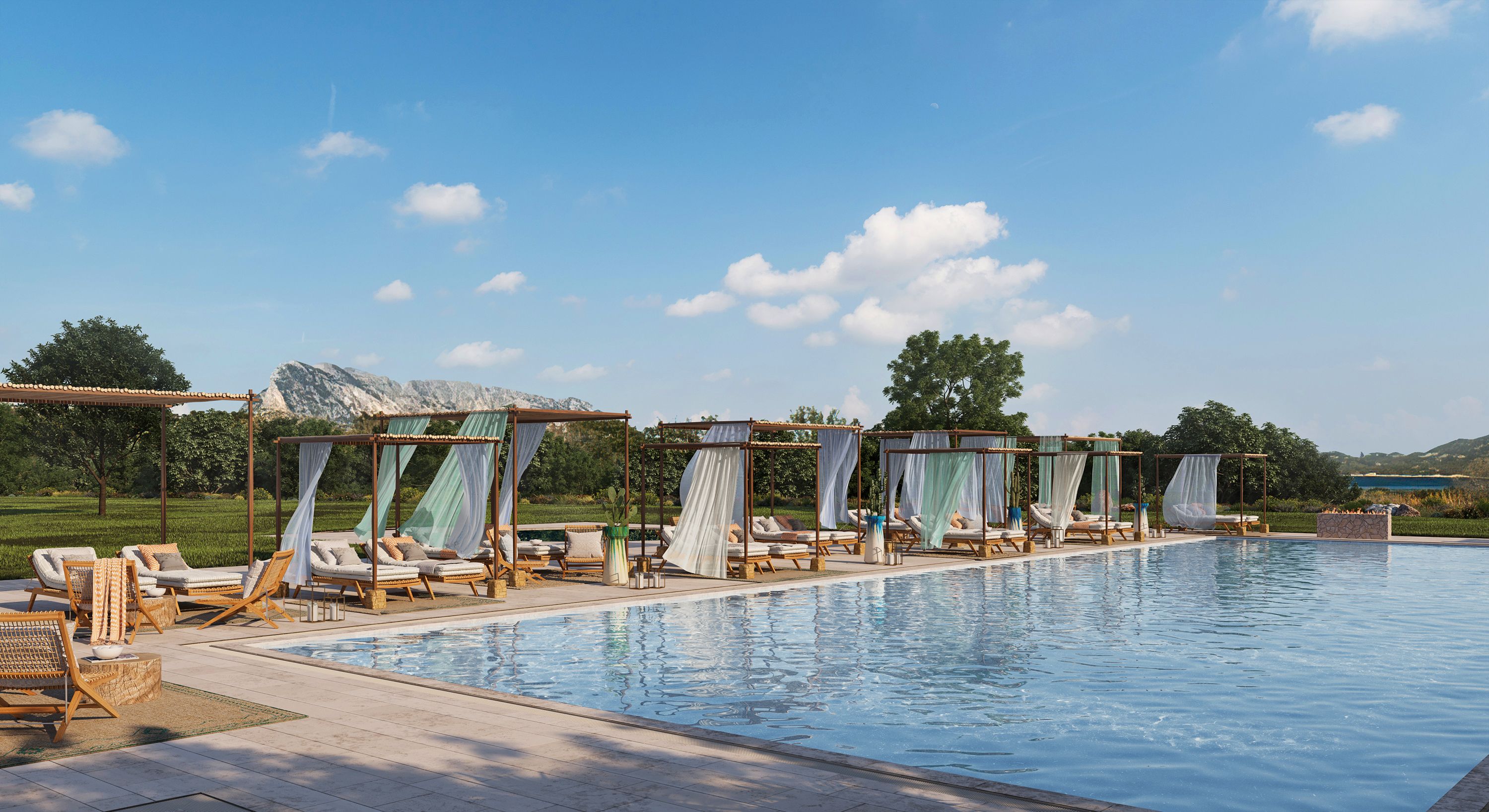 Zona junto a la piscina con sillones de descanso y toldos, cielo despejado y montañas al fondo.