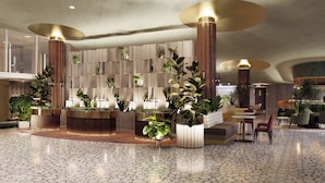 A modern lobby with a reception desk, potted plants, and a seating area with chairs. - Hyatt Regency Rome Central (Rome)