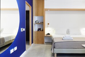 A modern hotel room with a bed, bedside table, and a built-in shelf unit. - Nabi Resort Glamping & Spa (Castel Volturno)