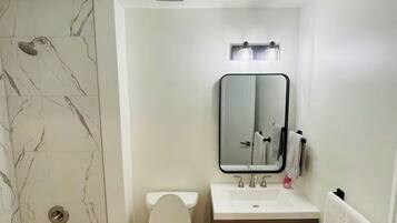 Shower, hair dryer, towels, soap
