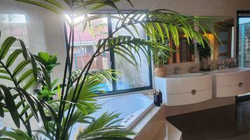 Jetted bath, hair dryer, towels, soap