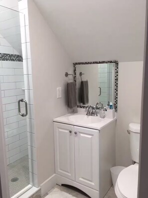Shower, hair dryer, towels, soap