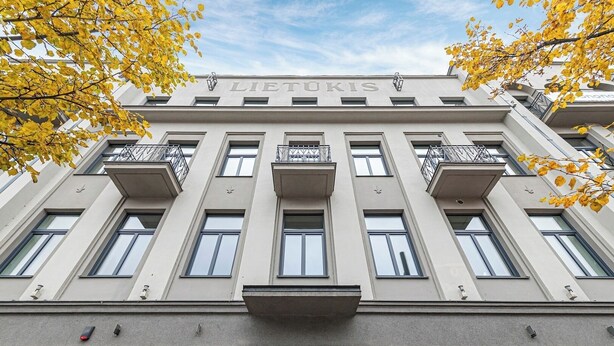 A building with the name 'LIETUKIS' on the facade, featuring a symmetrical design with multiple windows and balconies. - Vytauto 43 Residence – Lietūkis by Domvia (Kaunas)