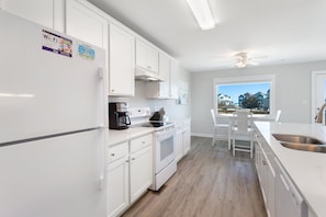 Coffee/tea maker, fridge, microwave, oven - Pelican: Buxton Townhouse w/ Ocean Views & Porch (Buxton)