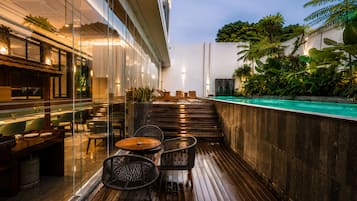 Outdoor pool, open 6:00 AM to 7:00 PM, pool umbrellas, pool loungers